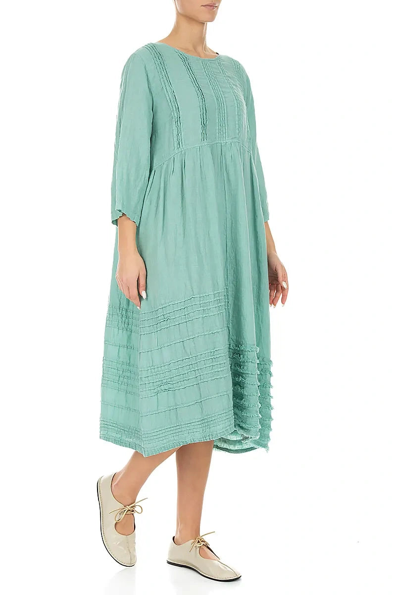 Robe en lin vert menthe à smocks et ourlet effiloché