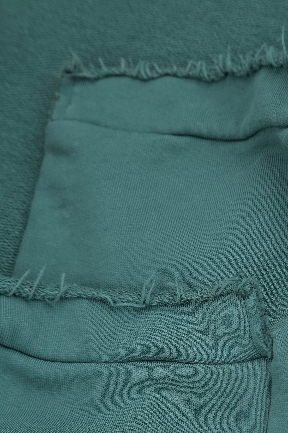 Asymmetrische Dunkeltürkis-Bluse aus French-Terry-Baumwolle