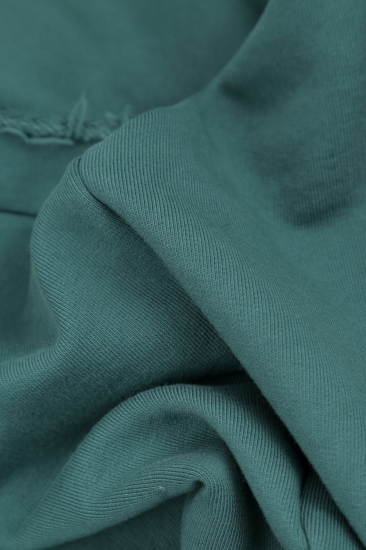 Asymmetrische Dunkeltürkis-Bluse aus French-Terry-Baumwolle