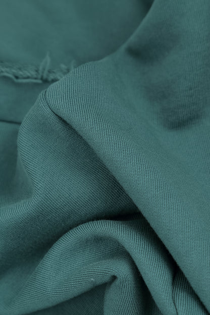 Asymmetrische Dunkeltürkis-Bluse aus French-Terry-Baumwolle