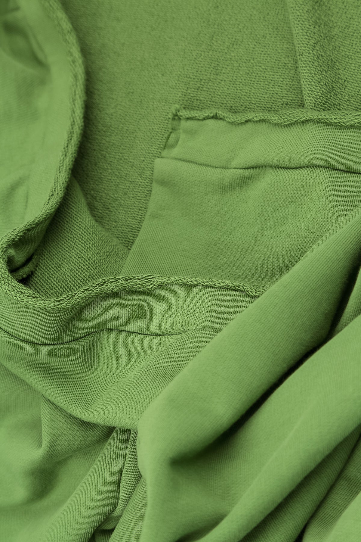 Asymmetrische Kleeblattgrüne Bluse aus French-Terry-Baumwolle