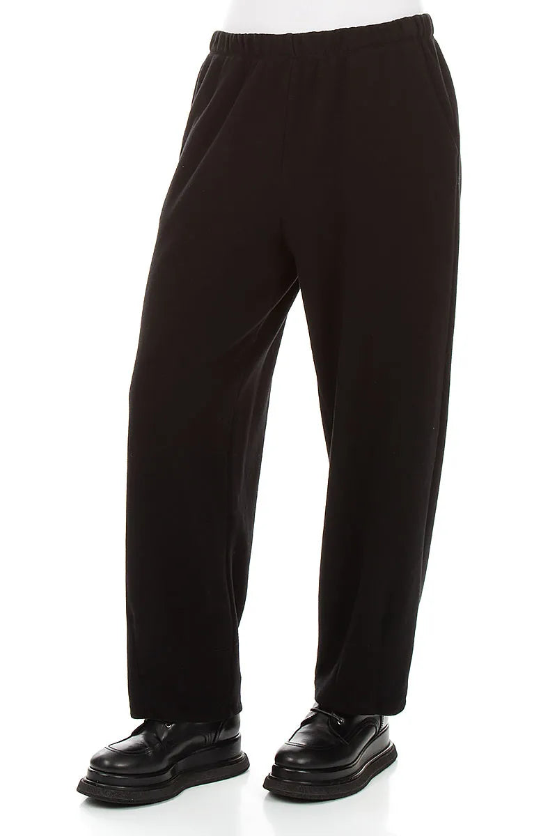 Lange, schmal zulaufende Hose aus schwarzem Baumwolljersey