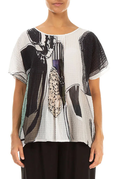 Chemisier en soie texturée effet pierre roulée à plis piqués