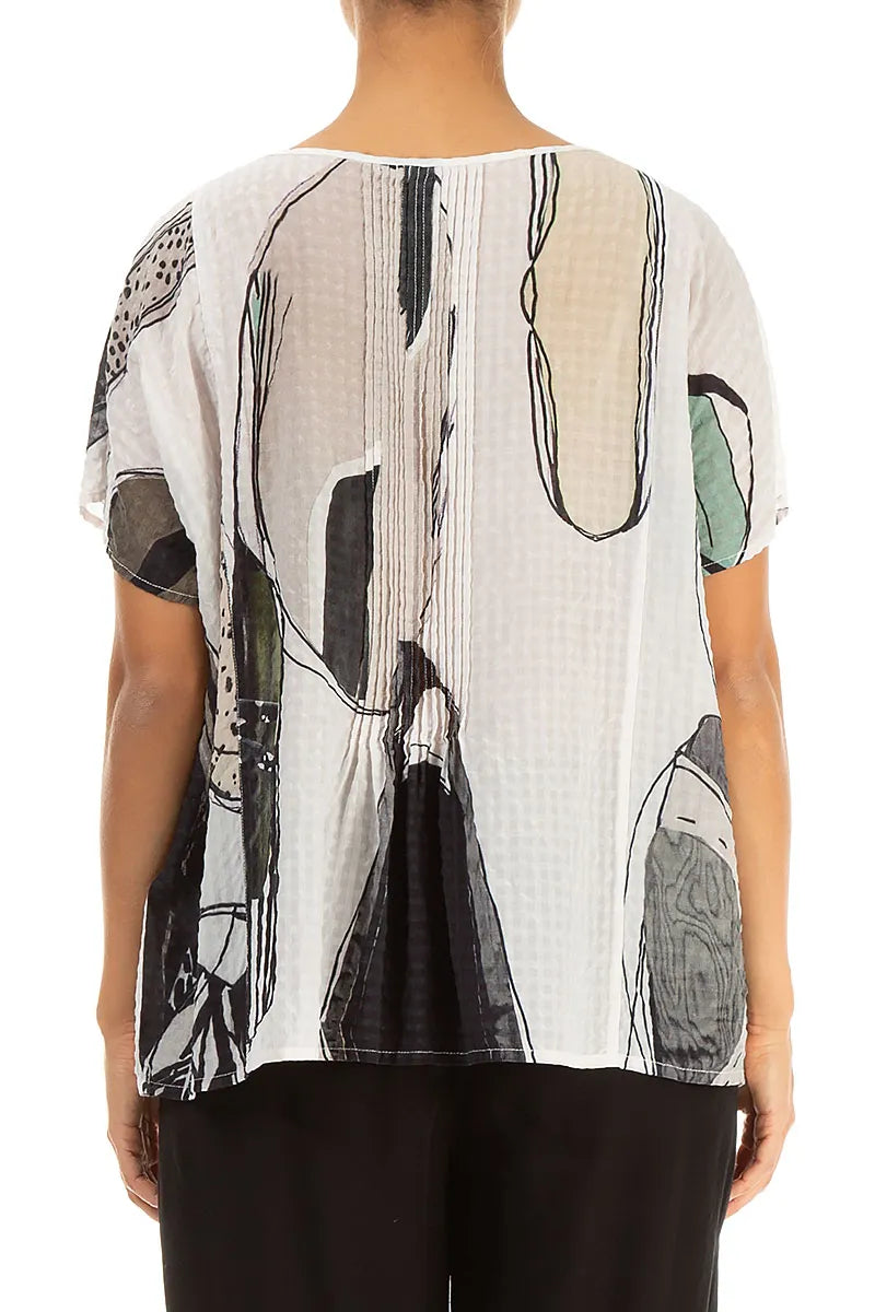 Chemisier en soie texturée effet pierre roulée à plis piqués