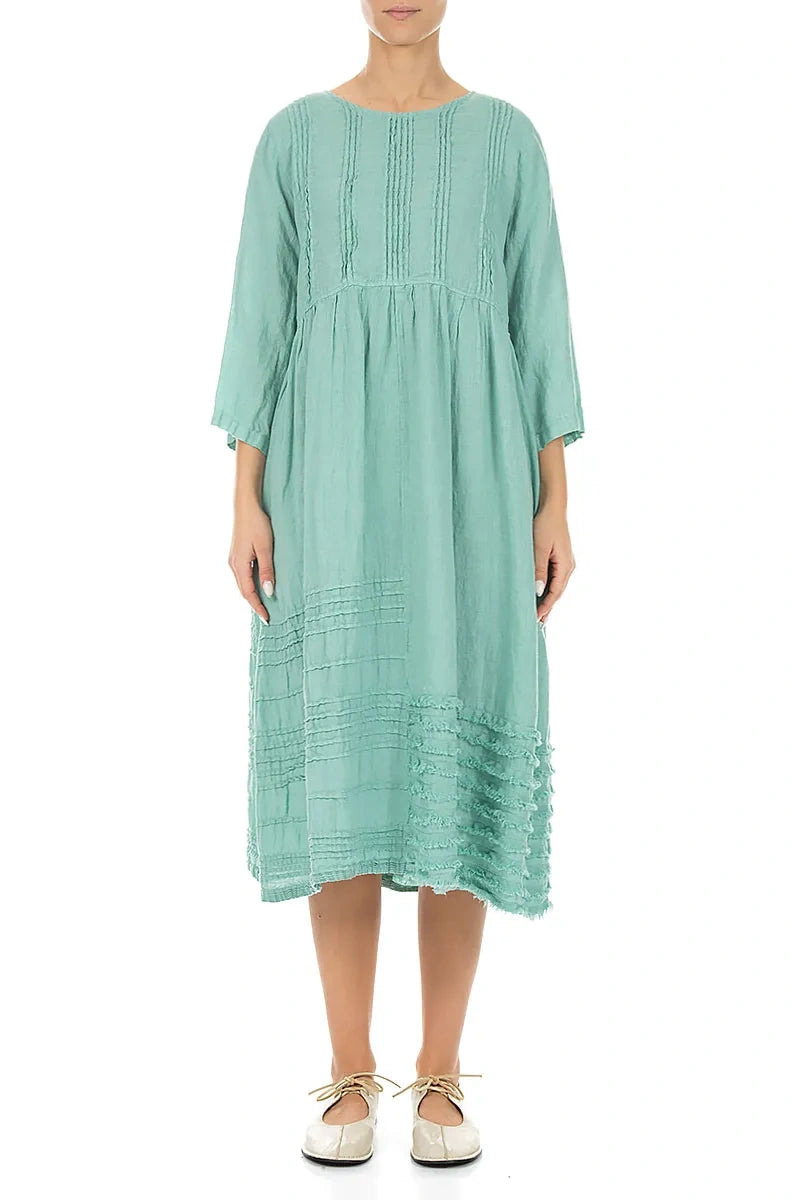 Robe en lin vert menthe à smocks et ourlet effiloché