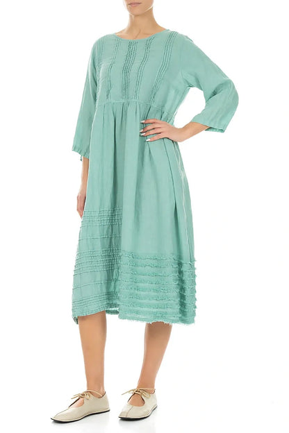 Robe en lin vert menthe à smocks et ourlet effiloché