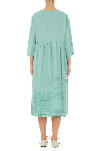 Robe en lin vert menthe à smocks et ourlet effiloché