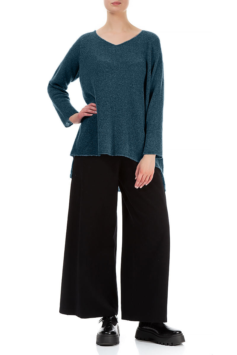 Pull en laine turquoise à col en V et dos plus long